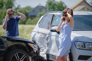 two people on the phone after car accident