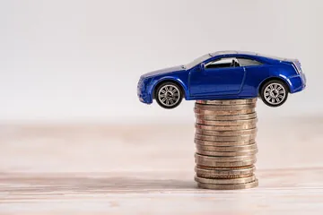 car ontop of coins