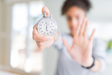 woman holding stopwatch